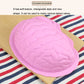 Pink silicone brain mold showing raised brain ridges and grooves.