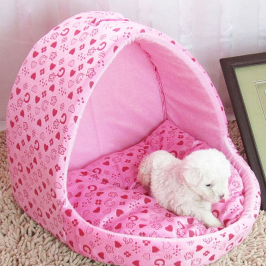 Pink yurt pet house with heart-print fabric; small dog resting inside