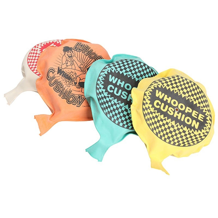 Set of whoopee cushion gag toys in orange, teal, and yellow with checkered logo text.