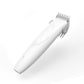White handheld electric pet grooming clipper with blade guard comb attached