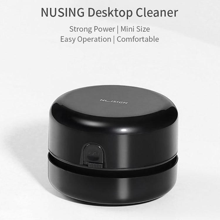 Black round mini desktop cleaner with front power switch cover on the base