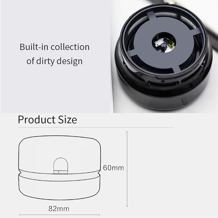 Black mini desktop cleaner underside viewed from above with built-in compartment