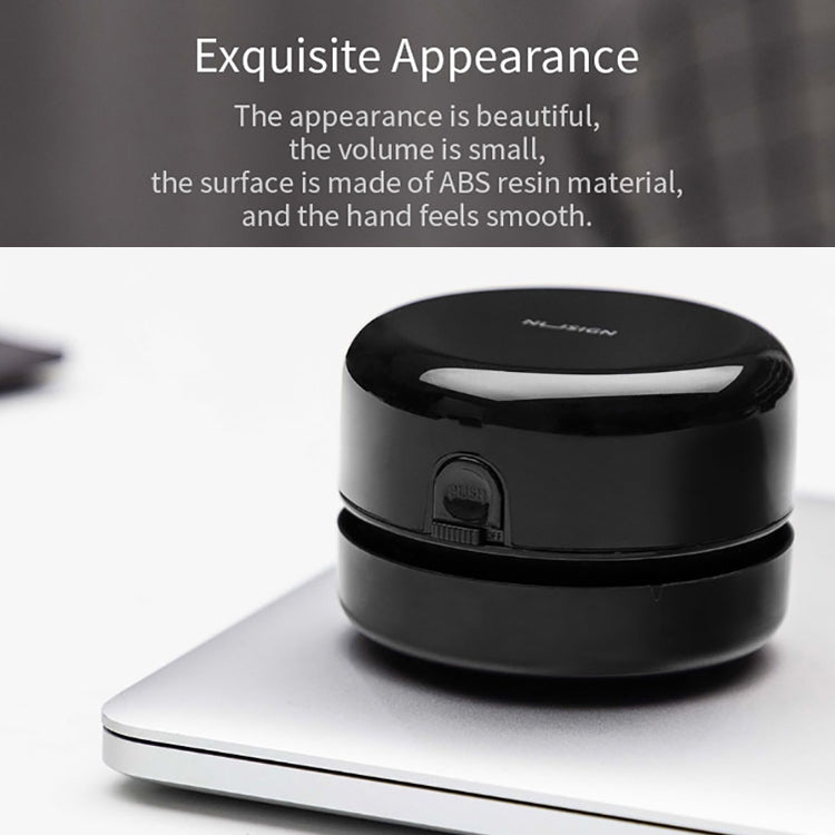 Black round desktop cleaner with lid and front switch on the lower base