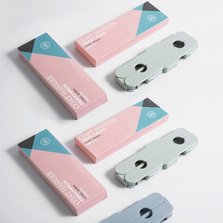 Light blue foldable clothes drying hanger rack with clips, shown with multiple units