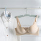Light green foldable clothes drying hanger rack hanging a bra and shirt on a bar