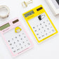 Assorted color 8-digit LED calculators with transparent touchpads and solar panels.