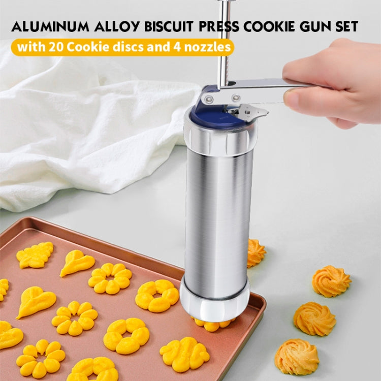 Aluminum biscuit press cookie gun on baking tray, shaping cookies on parchment