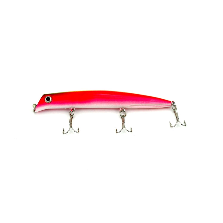 Popper fishing lure in red-pink with three treble hooks