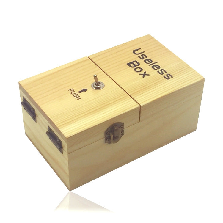 Wooden useless box with push button and engraved "Useless Box" on the lid