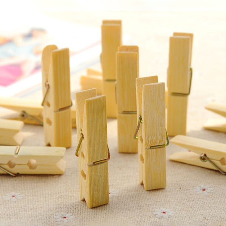 Assorted bamboo peg clothespins with metal springs, small clips for hanging