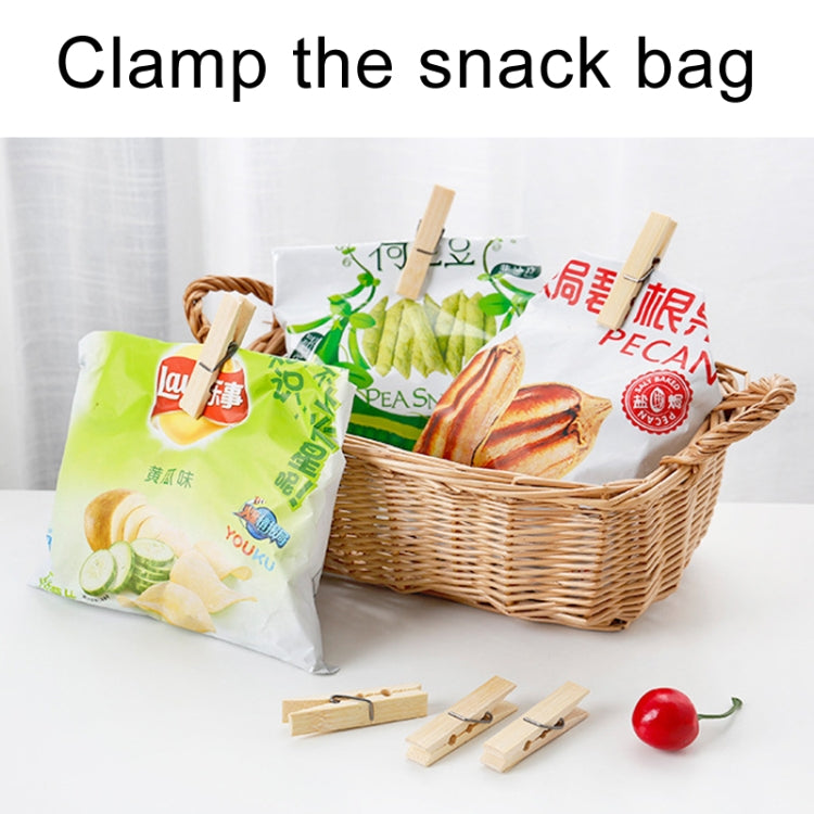 Bamboo mini clothespin clips holding folded plastic bags for laundry or crafts