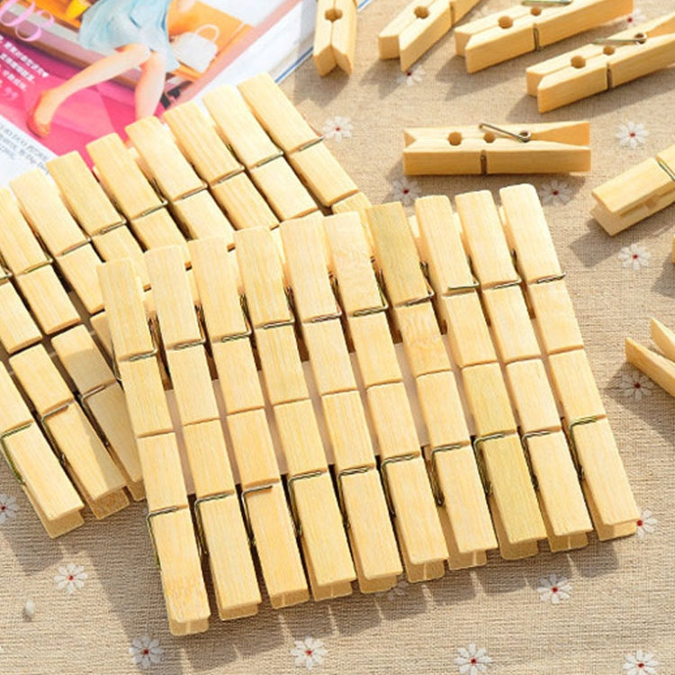 Pack of bamboo peg clips laid in rows, each with a metal spring clamp
