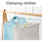 Bamboo clothespin peg clips clamping laundry on a hanger bar