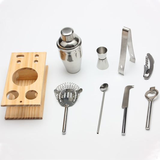 Cocktail shaker tool set pieces: metal jigger, strainer, and wooden rack