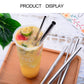 Reusable stainless steel drinking straws with cleaner brush beside iced drink