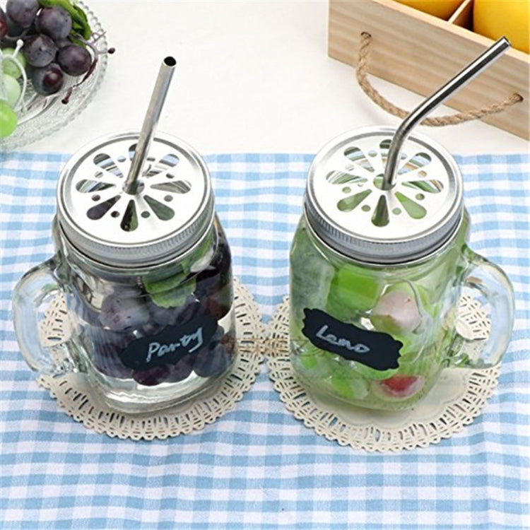 Stainless steel drinking straws in mason jars on lace coasters