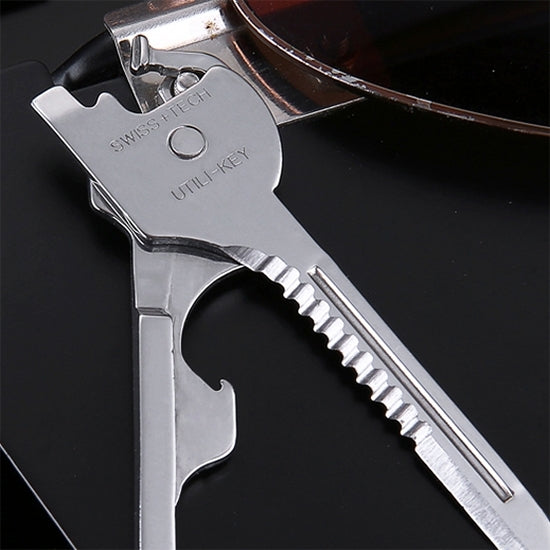 Stainless steel keychain multi-tool showing serrated grip and screwdriver blade