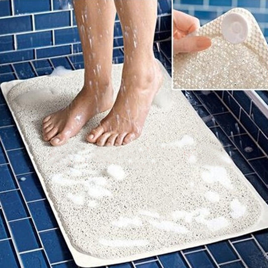 Rectangular white speckled anti-slip bath mat with textured surface and water-resistant PVC backing