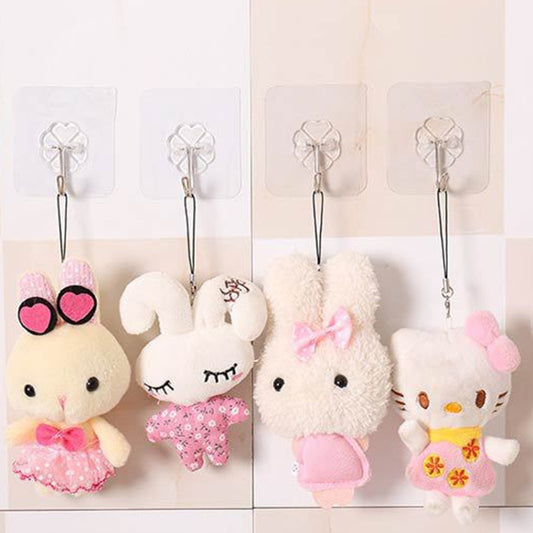 Transparent adhesive wall hooks holding plush hanging keychain toys