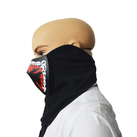 Black Halloween face mask with red-and-white mouth graphic, side view