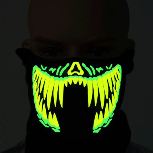 Black fabric LED Halloween face mask with bright green/yellow glowing jagged grin design