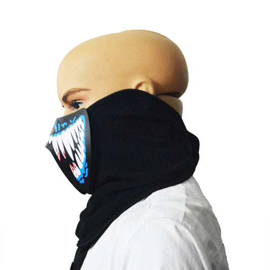 Black LED face mask with glowing teeth design, side view