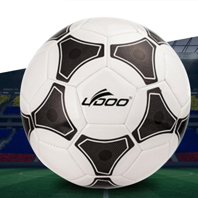 White PU soccer ball with black geometric panel accents and stitched seams.