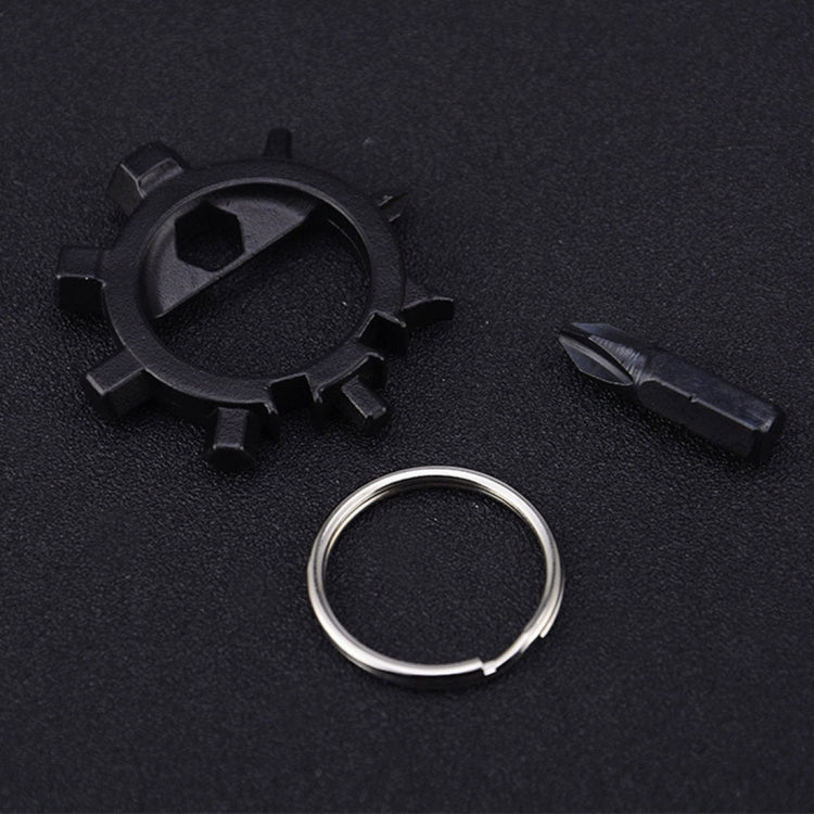 Black gear-style keychain tool with loop ring and black screwdriver bit