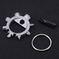 Silver circular gear tool with loop ring and black screwdriver bit