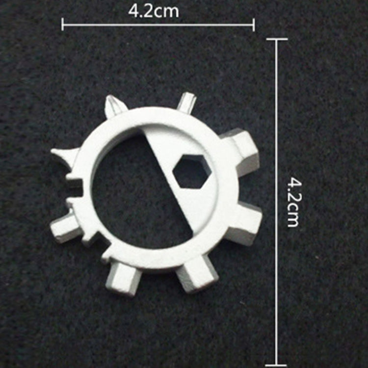 Silver gear-style keychain tool with loop ring and visible hex bit
