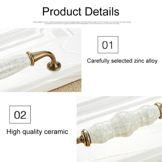 Close-up ceramic crackle cabinet handle with antique brass loop end and white crackle tube