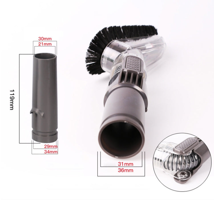Transparent brush head with black bristles, clear housing, and gray connector
