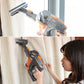 Grey handheld vacuum brush head kit with orange accents and extension tube