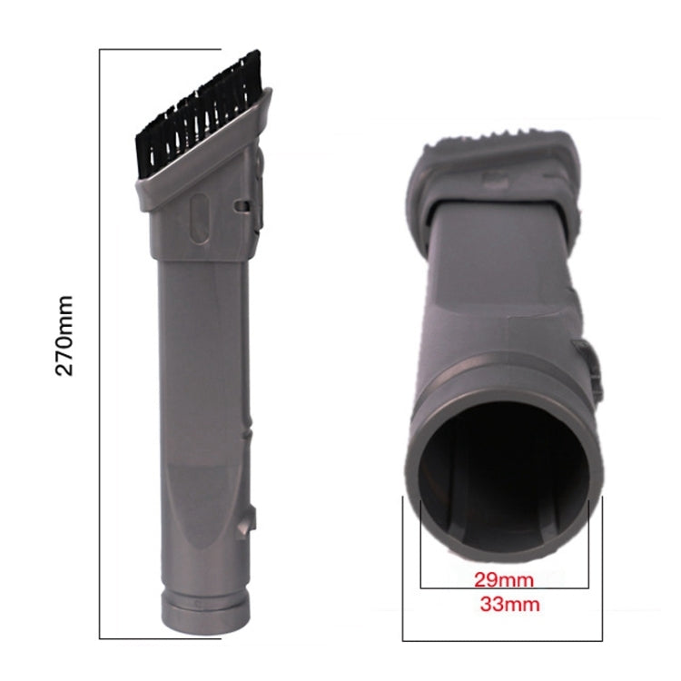 Angled grey vacuum brush attachment with black bristle strip, close-up