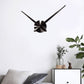 Black stainless steel wall clock with three-blade center and long hour and minute hands