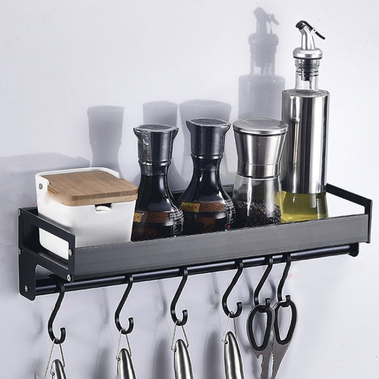 Black wall hanging kitchen storage rack with top shelf and six curved hooks