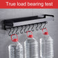 Black kitchen rack hook row holding water jugs on six curved hooks