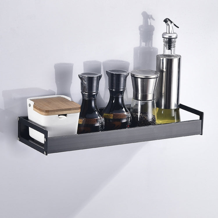 Black wall-mounted seasoning rack shelf with multiple spice containers and pump dispenser