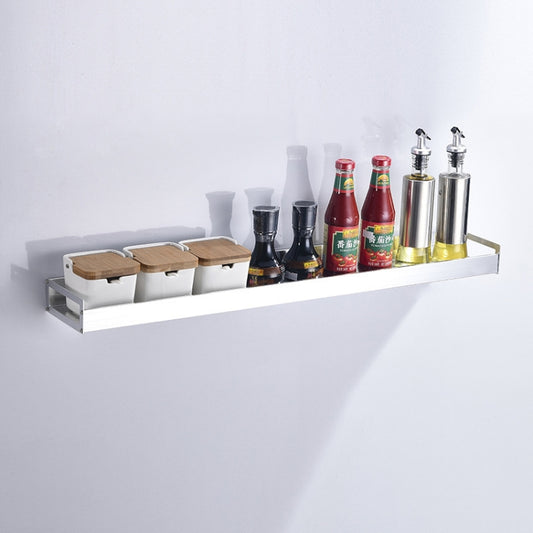 Silver wall-mounted seasoning storage rack with shelf holding spice bottles and jars