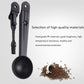 Two black coffee cleaning spoon tools with a small pile of coffee grounds