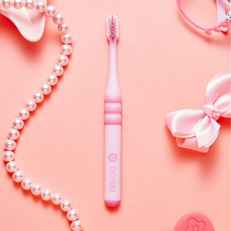 Pink children toothbrush with soft bristles and striped grip band on handle