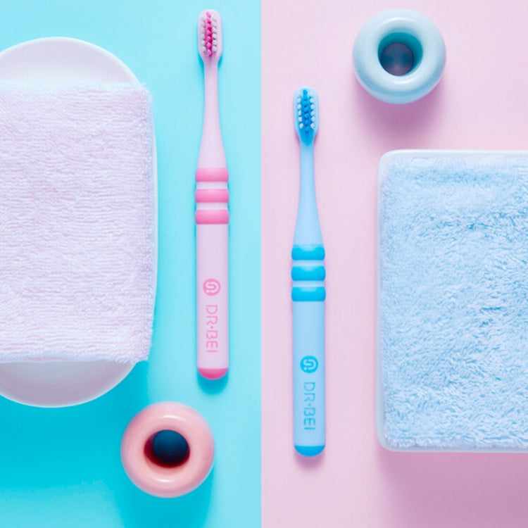 Two children toothbrushes, pink and blue, soft bristles with cushioned heads