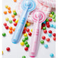 Pink and blue children soft toothbrushes with striped handles