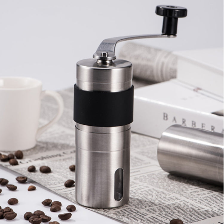 Manual conical burr coffee grinder with black grip and stainless steel body