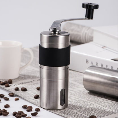 Manual conical burr coffee grinder with black grip and stainless steel body