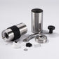 Manual coffee bean grinder in stainless steel with black silicone ring and crank knob; parts shown