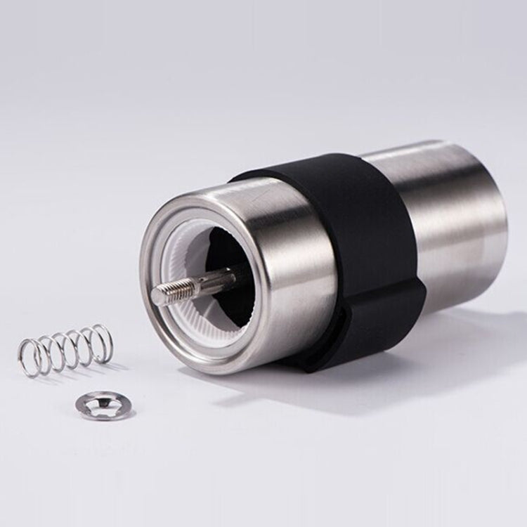 Manual coffee grinder with exposed conical burr and central adjustment spindle