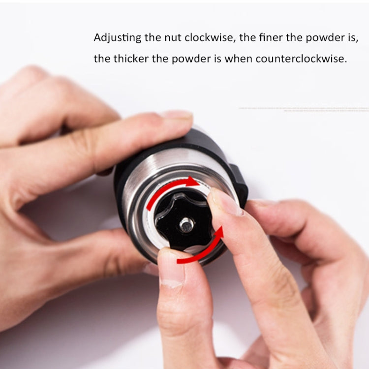 Hands adjusting the grinder nut on the inner black ring for fineness