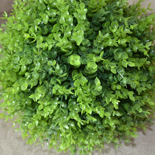 Artificial green eucalyptus foliage ball with dense small leaf clusters texture