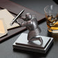 Knight-themed desktop pen holder with silver figurine holding a pen on a stand